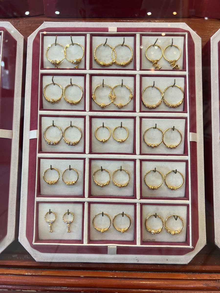 A display of 22ct gold hoop earrings in graded sizes, Kowaj Jewellers