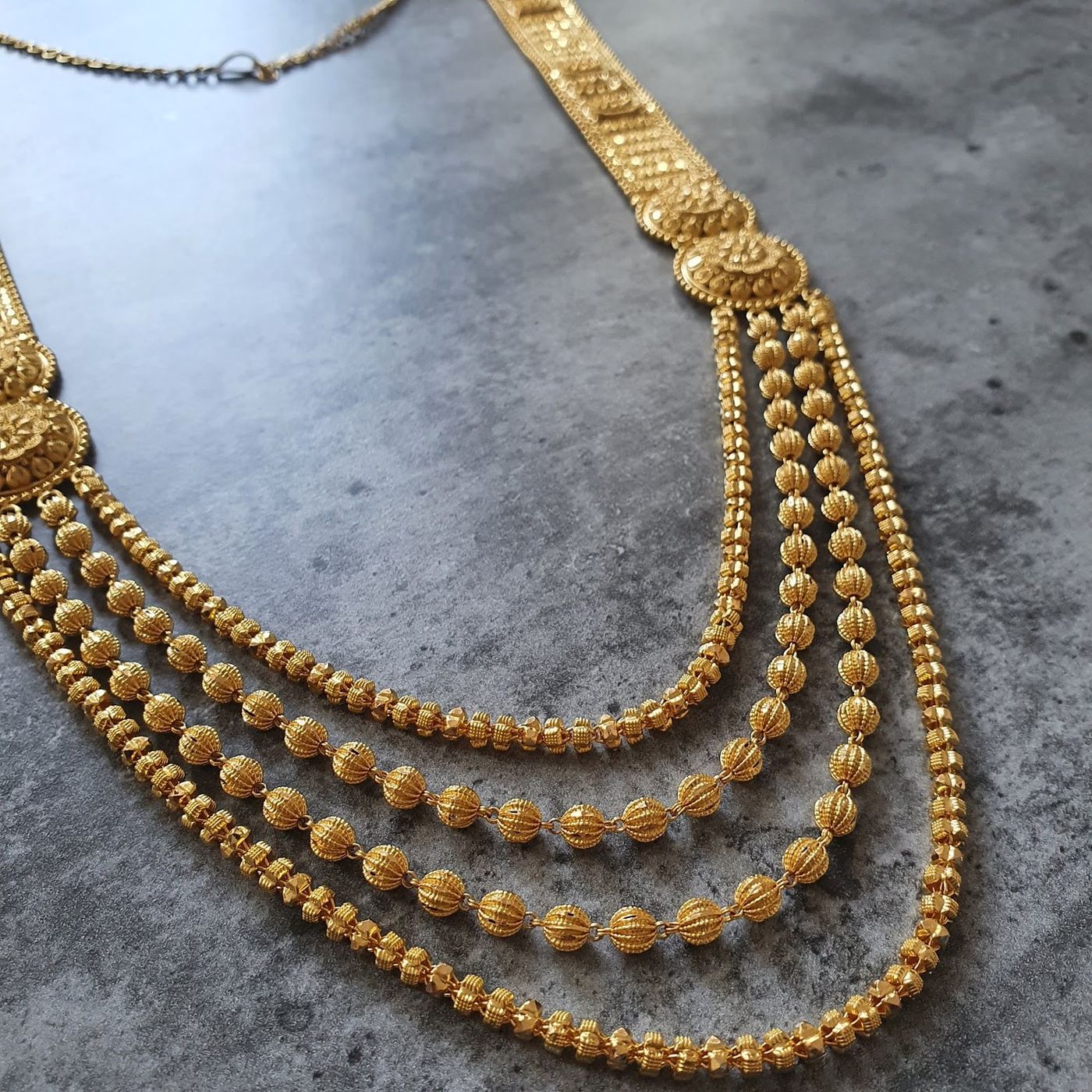 A layered 22ct gold ranihaar necklace with fine beadwork, from Kowaj Jewellers in Bethnal Green